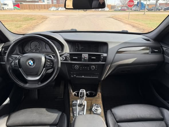 Clean black sedan dashboard after detailing