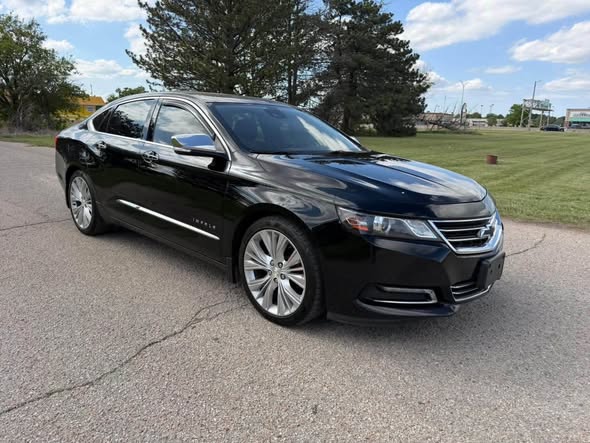 Freshly detailed black sedan parked outside